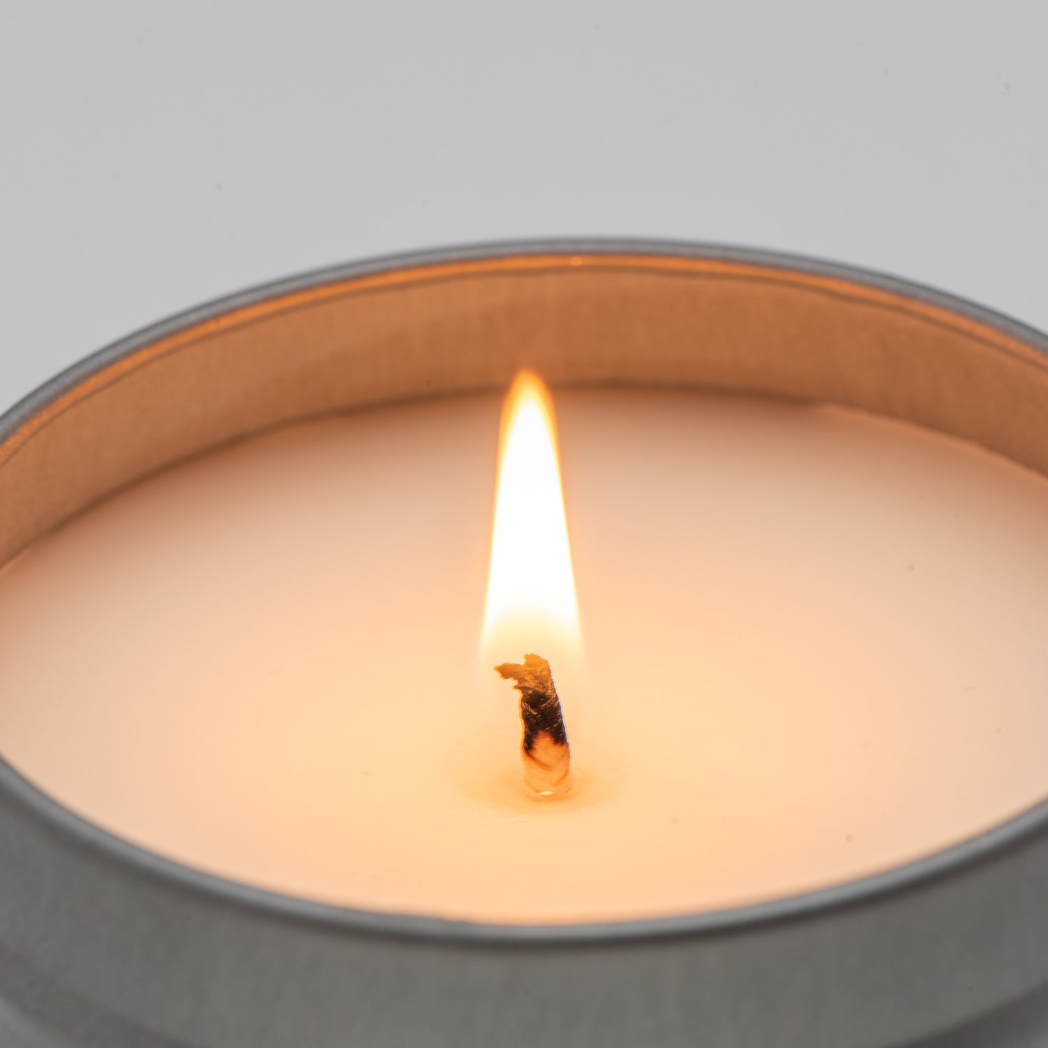Tin candle burning